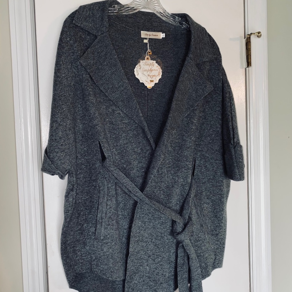 Short sleeved sweater wrap.